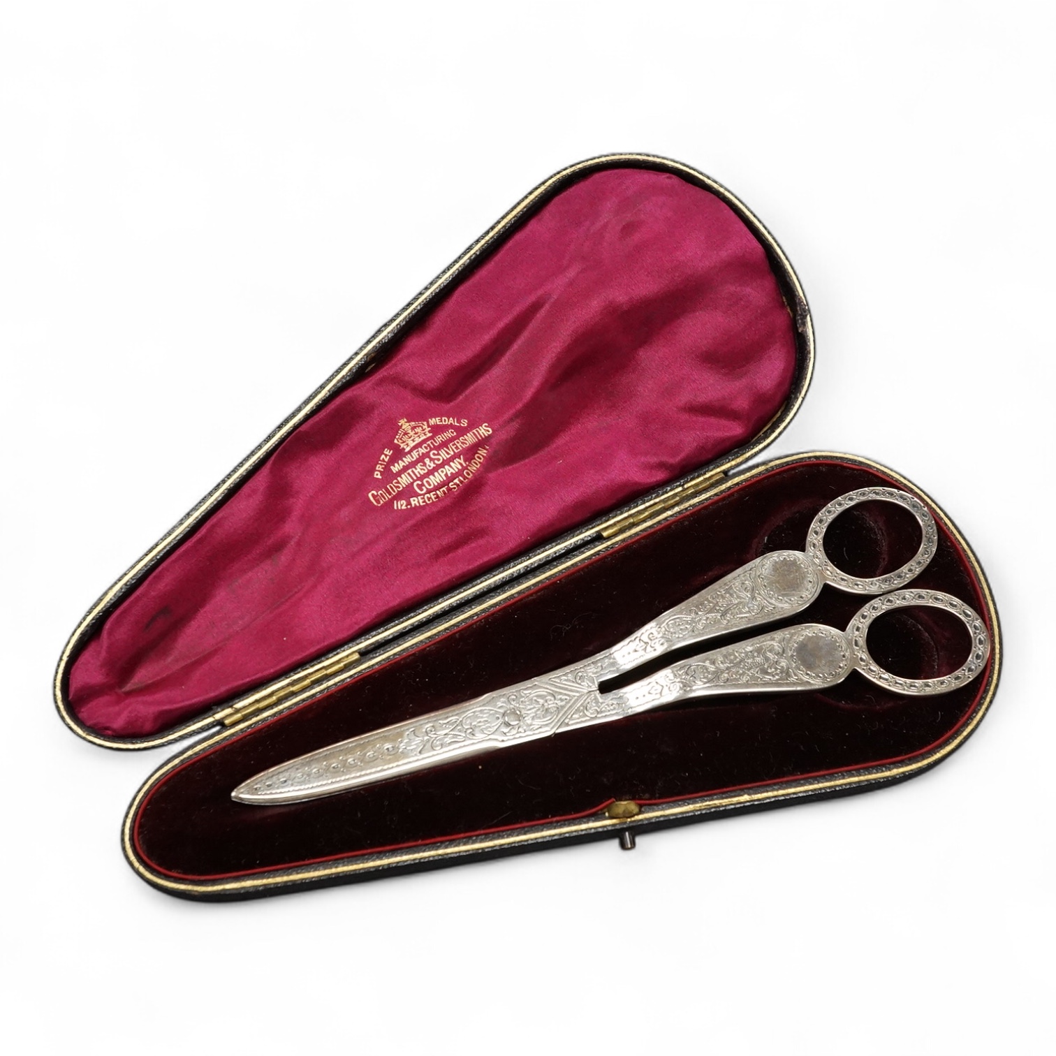 A cased pair of Victorian silver grape shears, by Aldwinckle & Slater, London, 1893, with engraved decoration, 16.4cm. Condition - fair to good